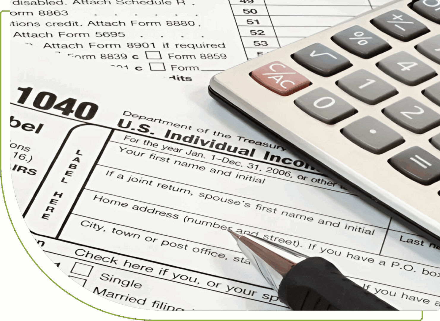 Calculator, pen, and tax forms for filing U.S. individual income tax.